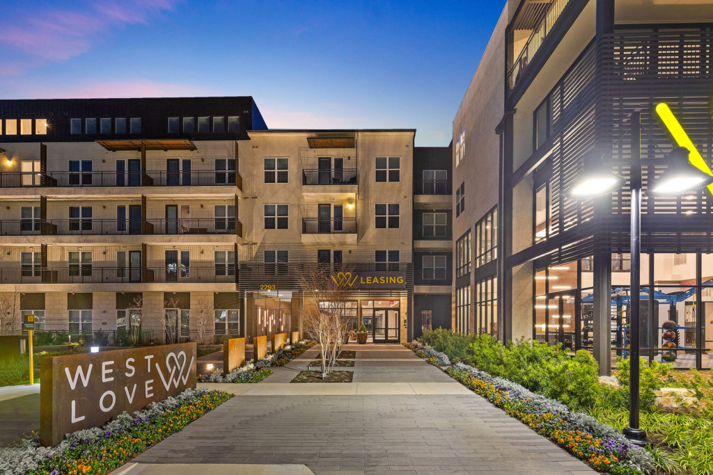 West Love Leasing office entrance with decorative landscaping